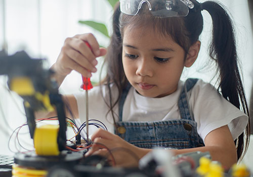 child conducting science experiment